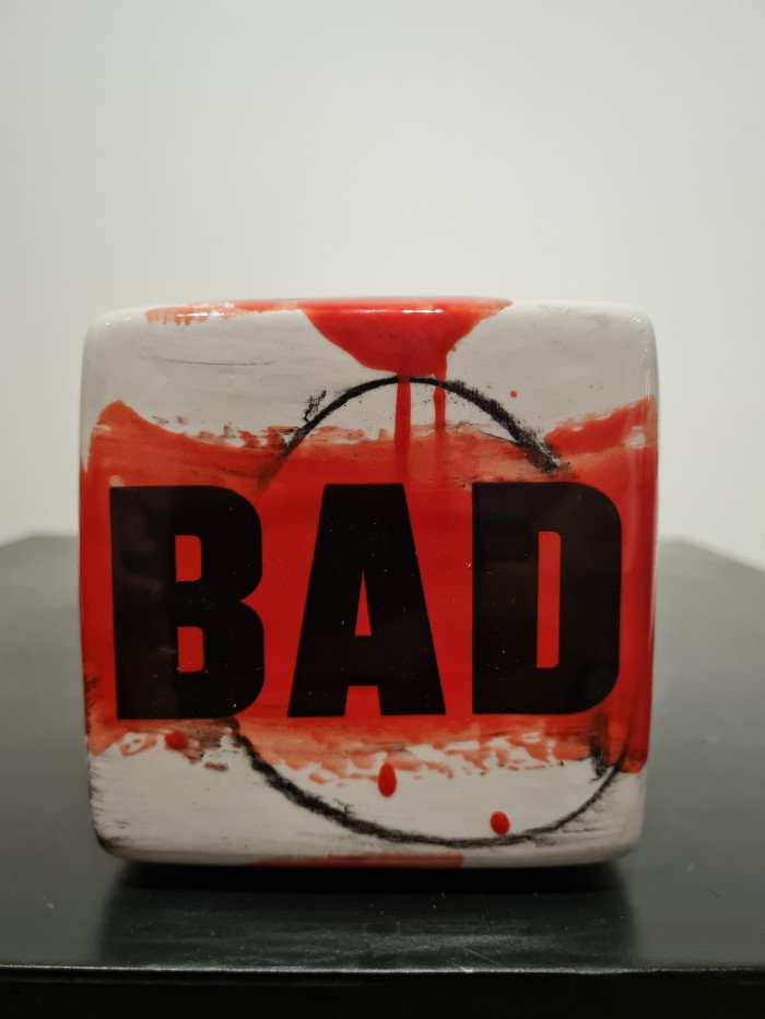 Cube red and white with bad letters in black