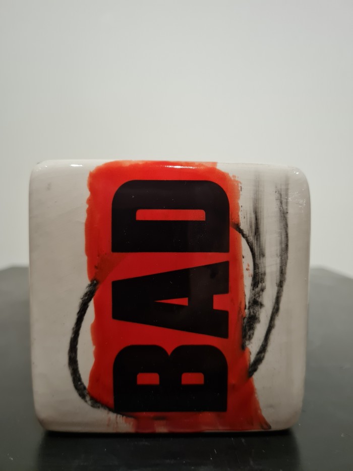 Cube red and white with bad letters in black