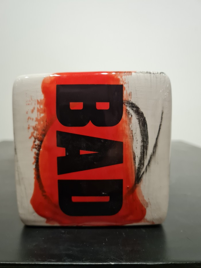 Cube red and white with bad letters in black