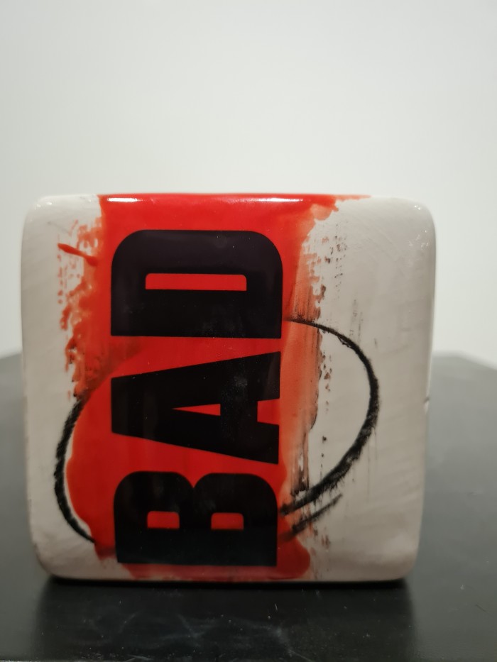 Cube red and white with bad letters in black