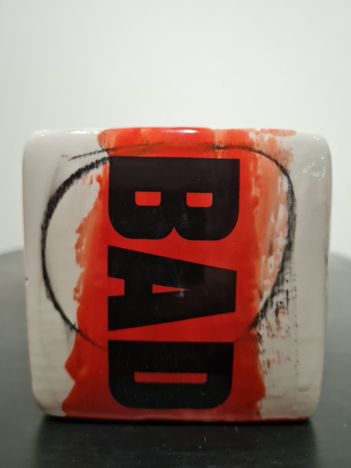 Cube red and white with bad letters in black