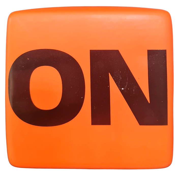 Orange cube with letters ON