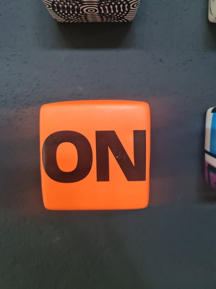 Orange cube with letters ON